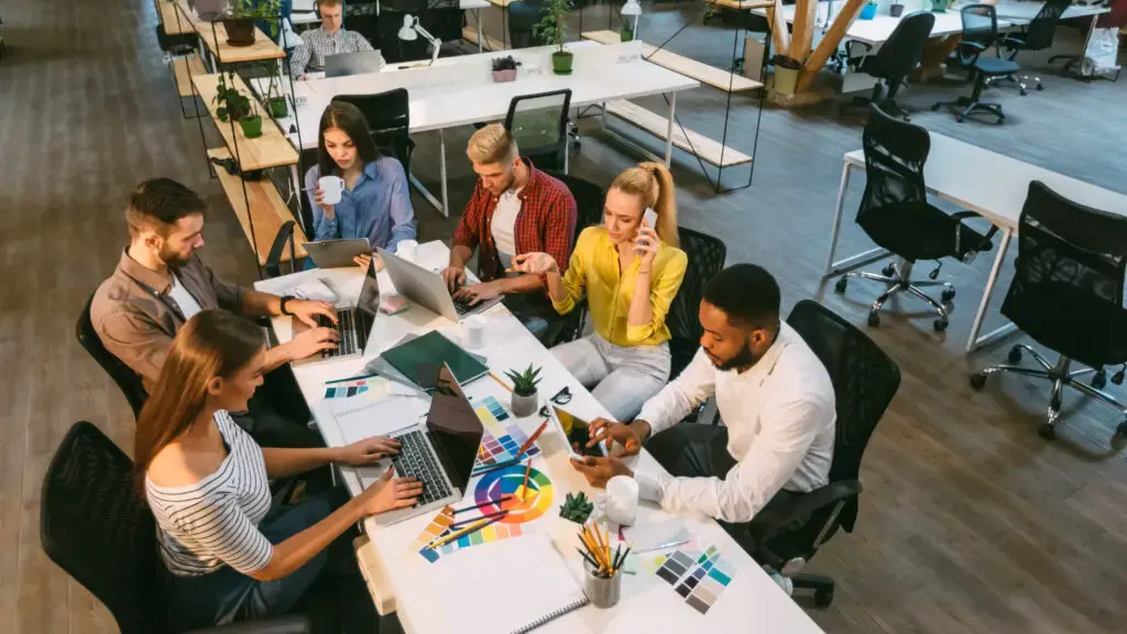Working process. Designer team working in coworking space, high angle view